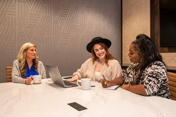 Three women working from home at The Residences at Galleria, Kansas, 66211